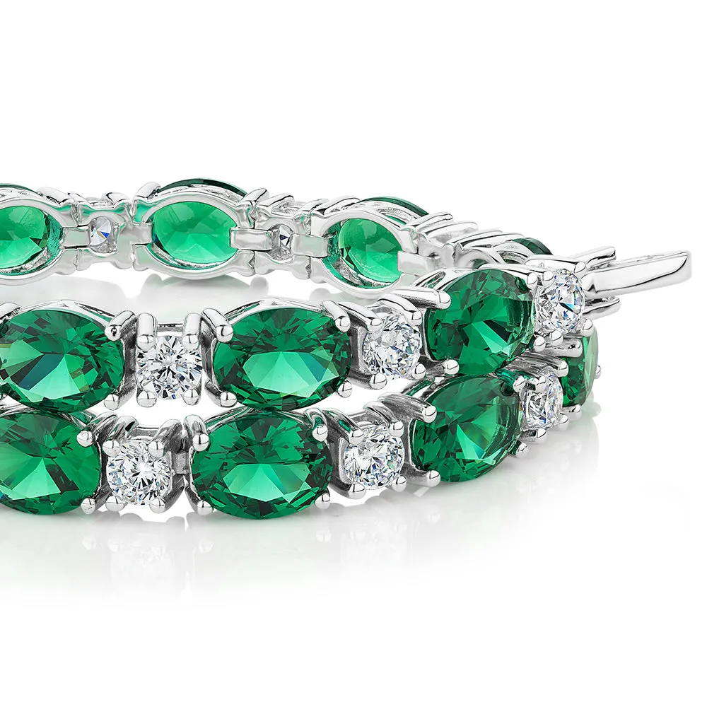 Round Brilliant tennis bracelet with emerald simulants and 3.36 carats* of diamond simulants in sterling silver